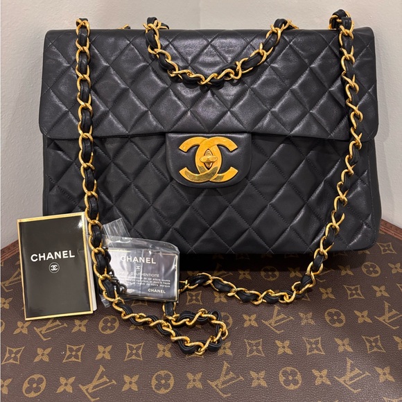 CHANEL Handbags - Authentic CHANEL JUMBO XL black lambskin single flap classic bag 24k gold